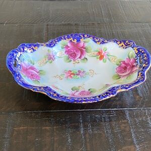 Hand-painted Nippon porcelain dish with roses and cobalt blue gilt rim.